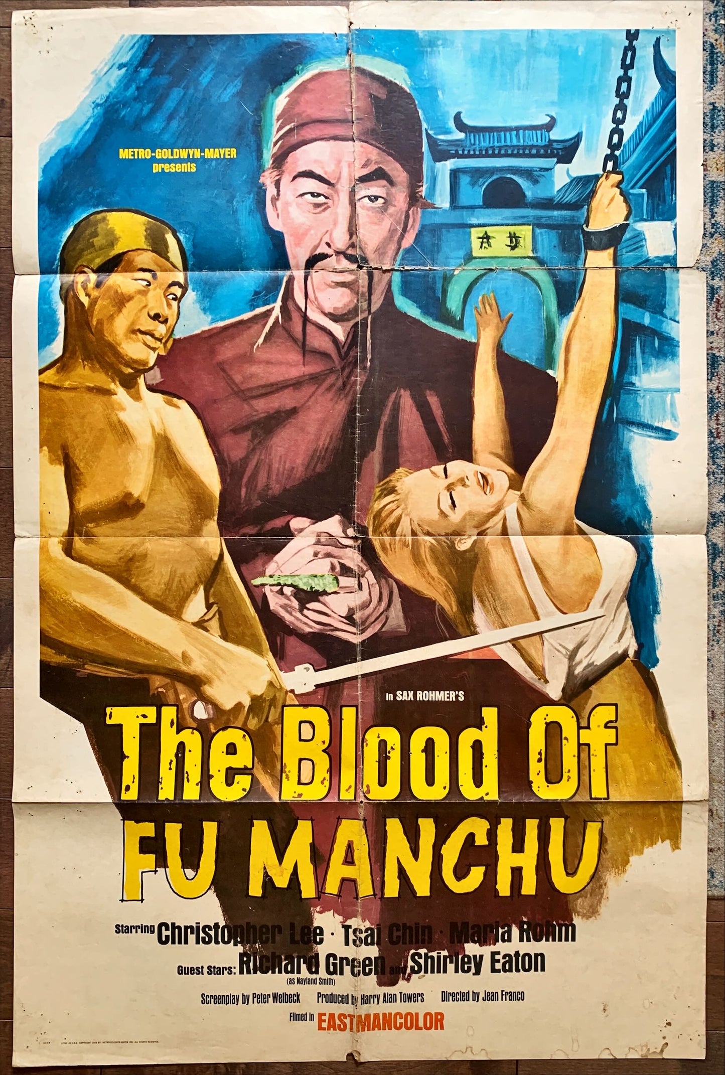 Blood of FuManchu, 1969 art of Asian villain Christopher Lee & girl tortured