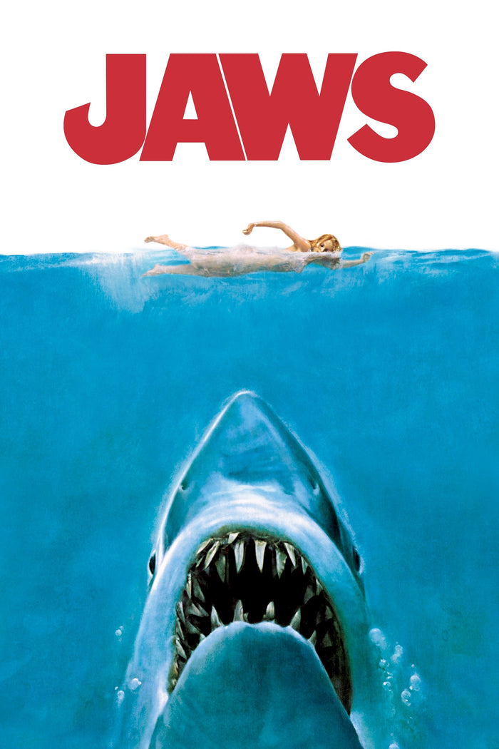 Movie poster for 'Jaws' with a shark emerging from the water and a person swimming above.